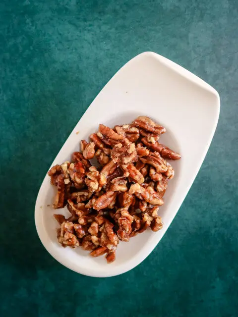 small dish with spiced pecans