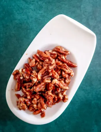 Spiced pecans on a serving dish.