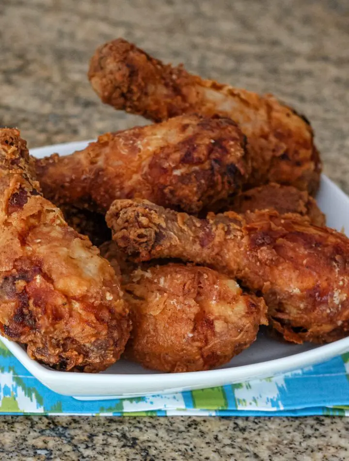 fried chicken drumsticks in a serving dish