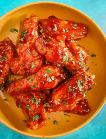 air fryer chicken wings with Korean inspired sauce in a bowl