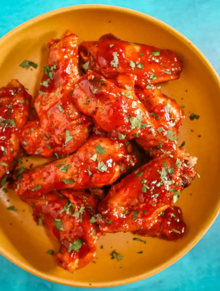 air fryer chicken wings with Korean inspired sauce in a bowl