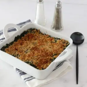 spinach casserole in the baking dish with crumb topping