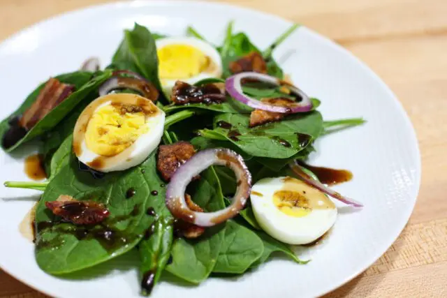 spinach salad on a plate