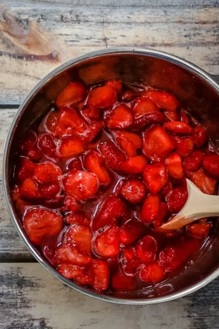 A bowl of strawberries macerated with orange liqueur