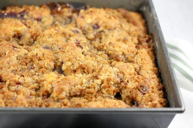 bake dish with a cake with streusel topping