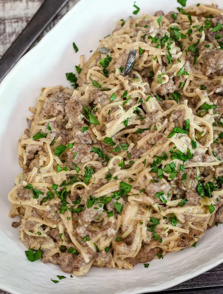 ground beef stroganoff with noodles in a serving dish