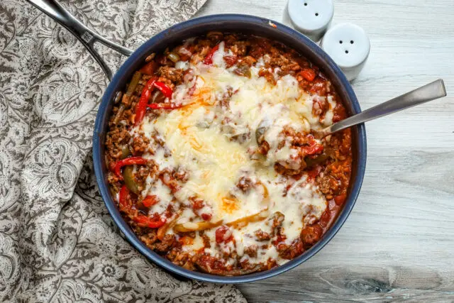 Stuffed pepper casserole with melted fontina cheese, a one pot meal made in a skillet and baked.