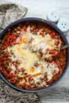 Stuffed pepper casserole with melted fontina cheese, a one pot meal made in a skillet and baked.