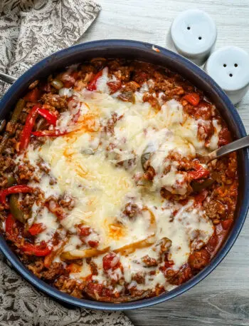 Stuffed pepper casserole with melted fontina cheese, a one pot meal made in a skillet and baked.