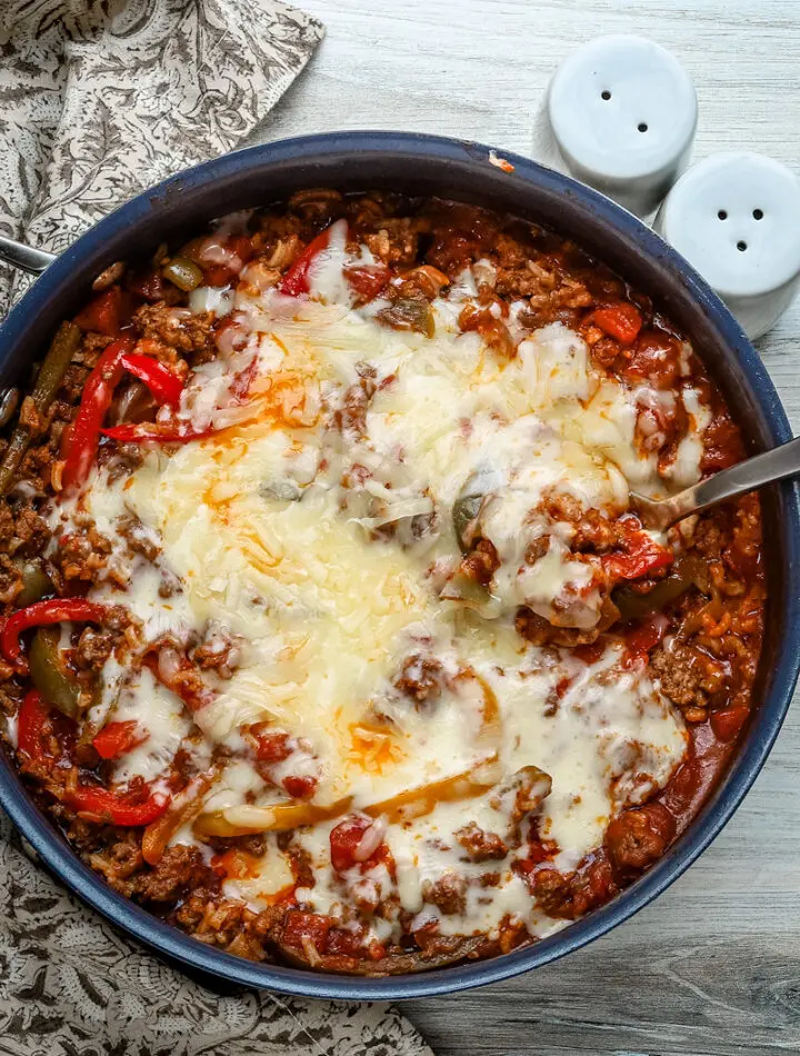 Stuffed pepper casserole with melted fontina cheese, a one pot meal made in a skillet and baked.