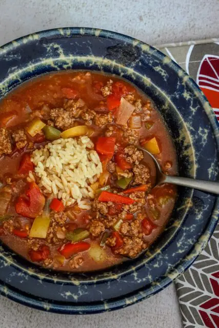 Stuffed pepper soup with ground beef, rice, and tomatoes.