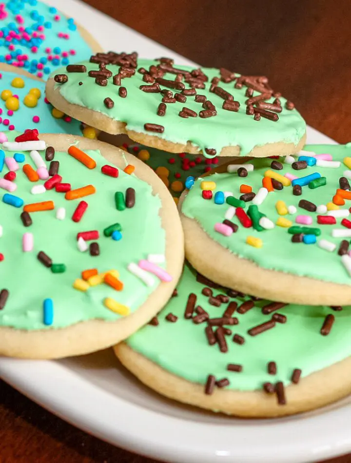 sugar cookies with royal icing on a small plate