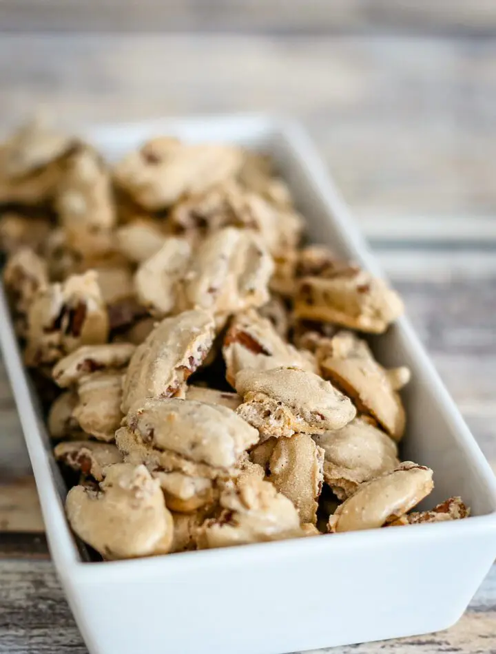 sugared pecans snack in a small decorative dish