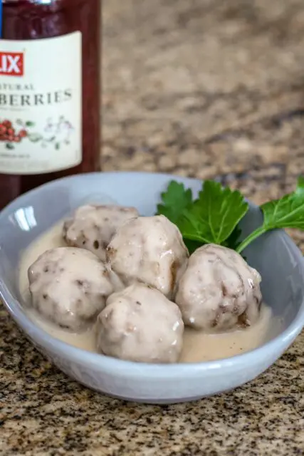 Swedish meatballs in a bowl with parsley