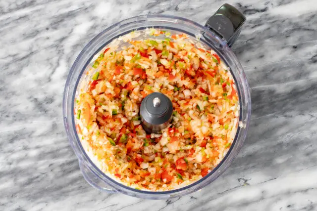 Preparing corn relish in the food processor.