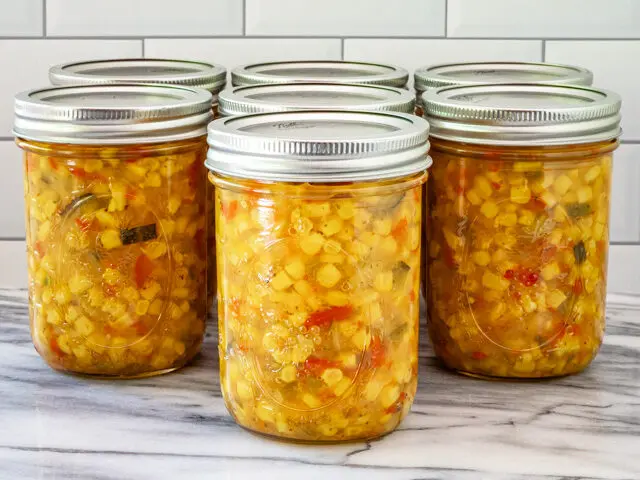 Homemade corn relish in jars.