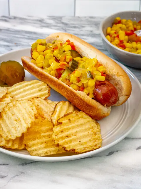 Home canned corn relish on a hot dog.