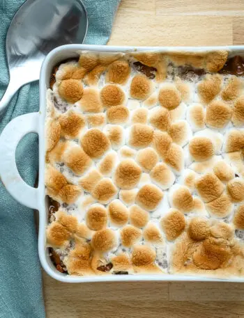 Sweet potato casserole for two in a small baking dish with marshmallow topping.