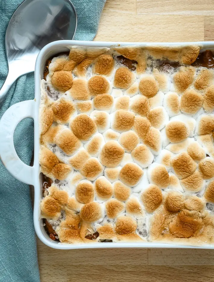 Sweet potato casserole for two in a small baking dish with marshmallow topping.