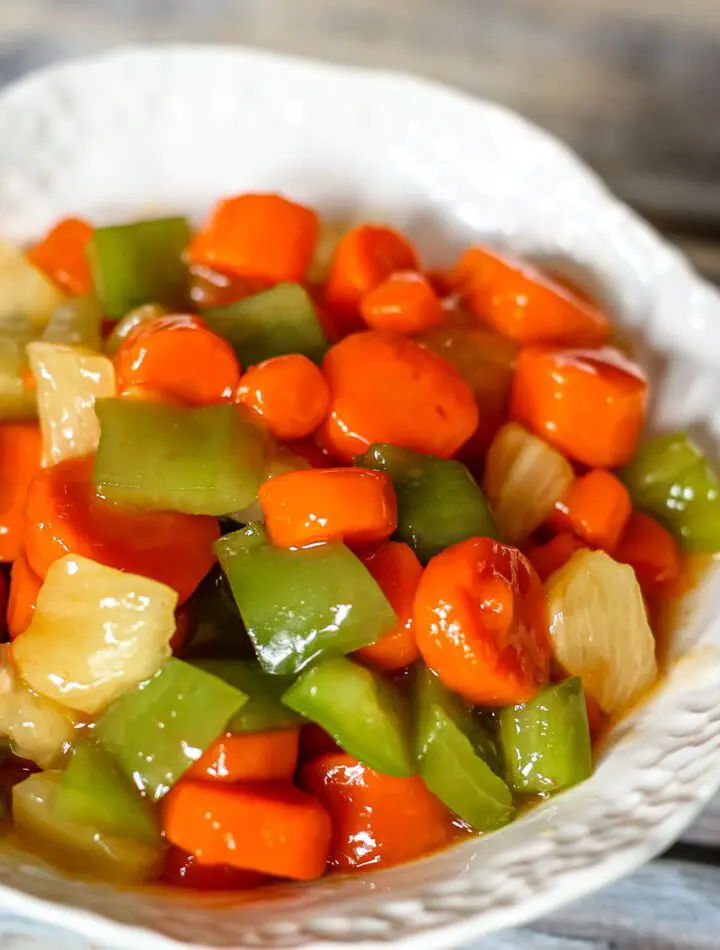 a serving bowl with sweet and sour carrots