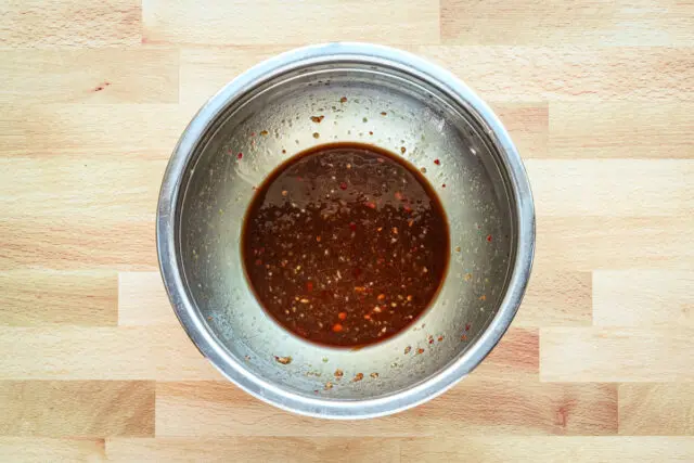 Sauce for teriyaki meatballs, made with soy sauce, vinegar, sambal, and brown sugar.