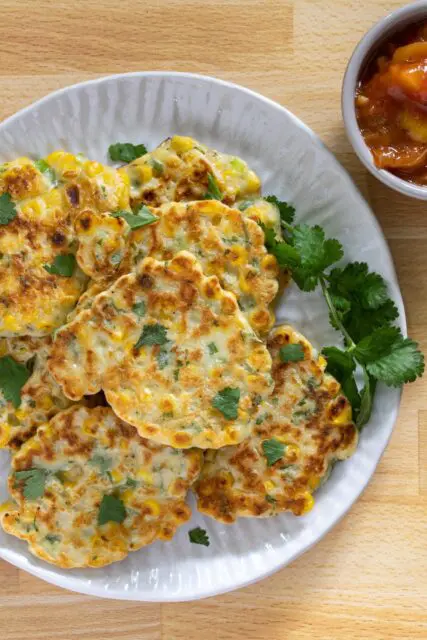 tex mex fritters on a plate with cilantro