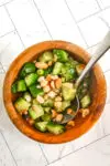 A small bowl with Thai cucumber salad.