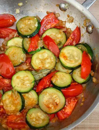 zucchini and tomatoes in a skillet