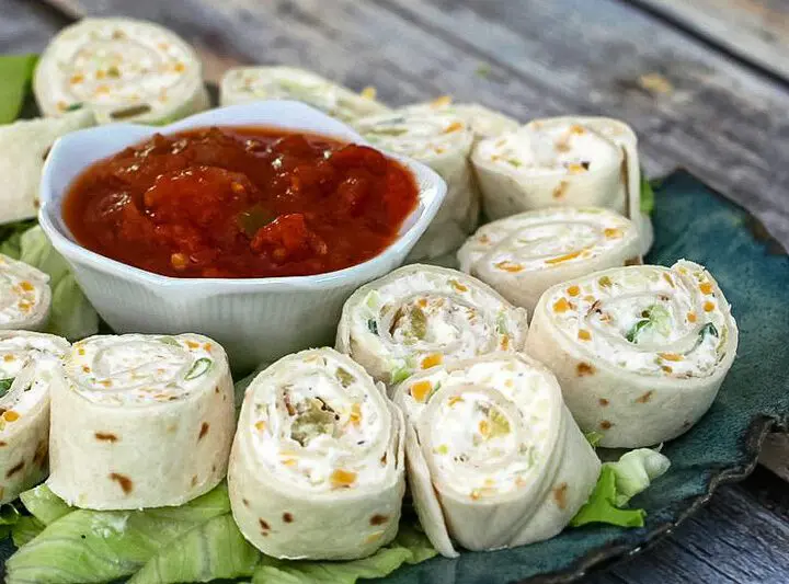 tortilla roll-ups with salsa for serving