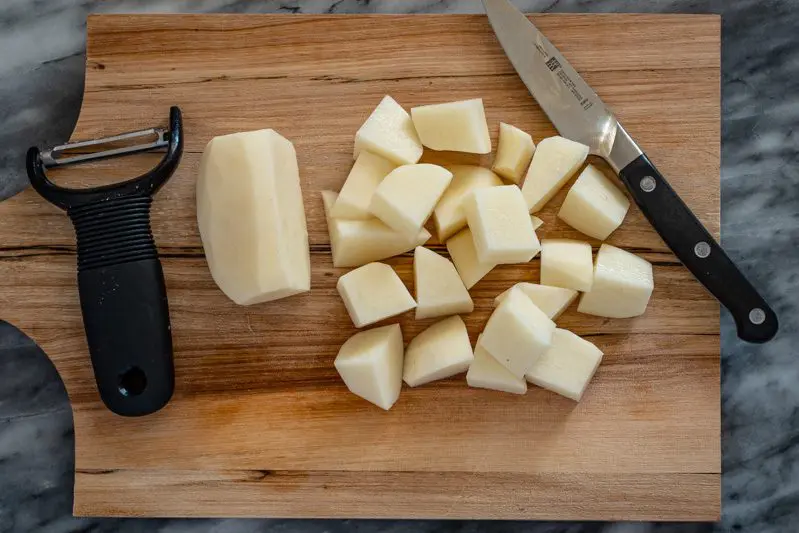 cut-up potatoes on a cutting board