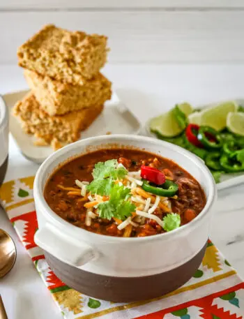 chili in a bowl with garnishes