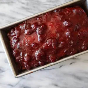 cranberry glazed meatloaf in the baking pan