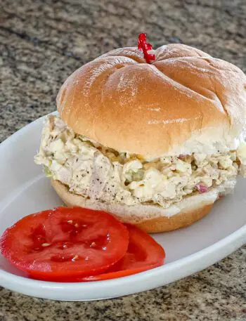 turkey and egg salad sandwich on a soft bun