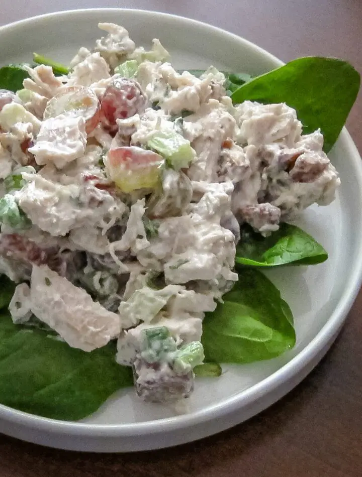 curry turkey salad with grapes on lettuce leaves