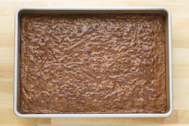 Perfectly baked brownies with a crackled top and chewy, soft center.