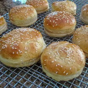 wheat hamburger buns on a cooling rack