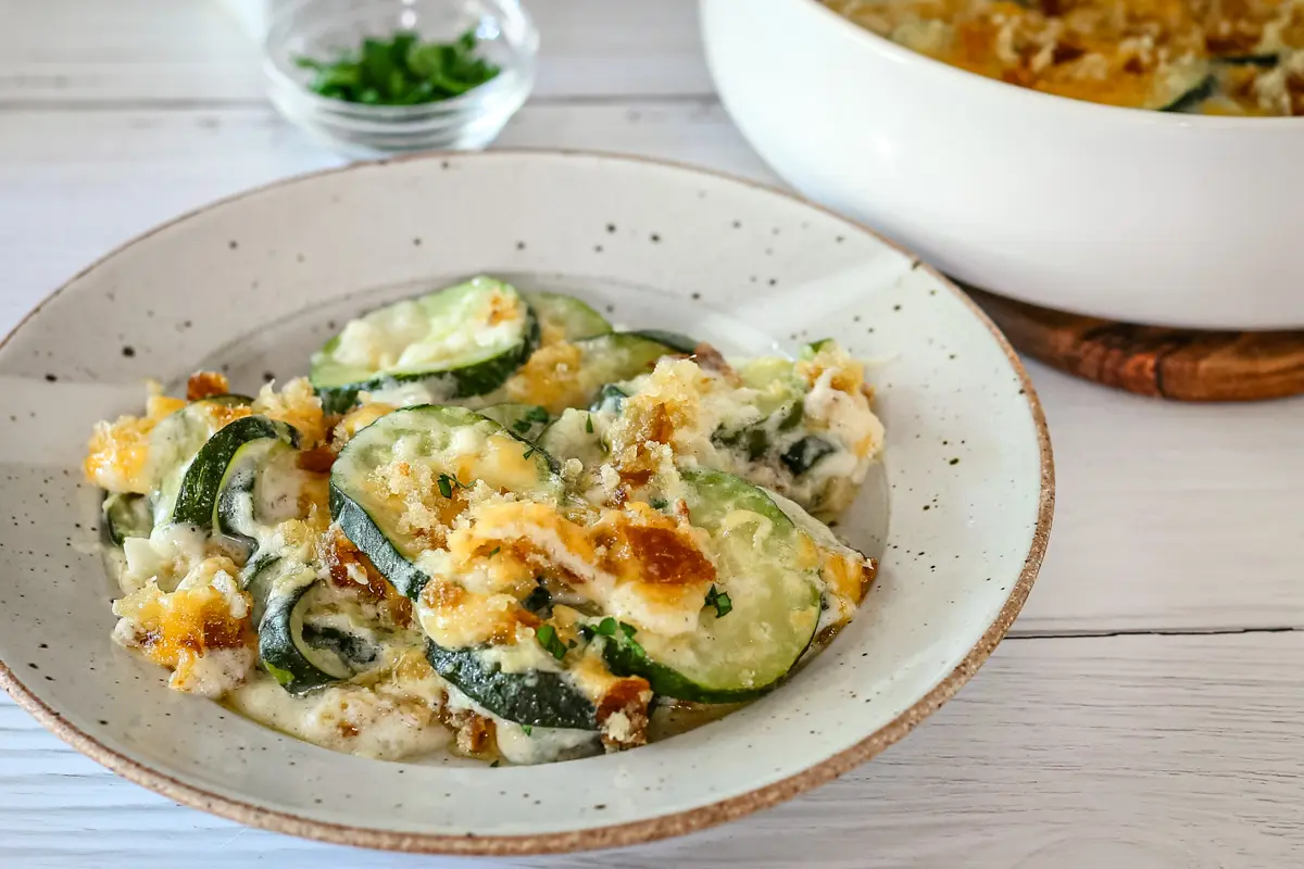 Closeup of zucchini casserole with breadcrumb and cheddar topping.