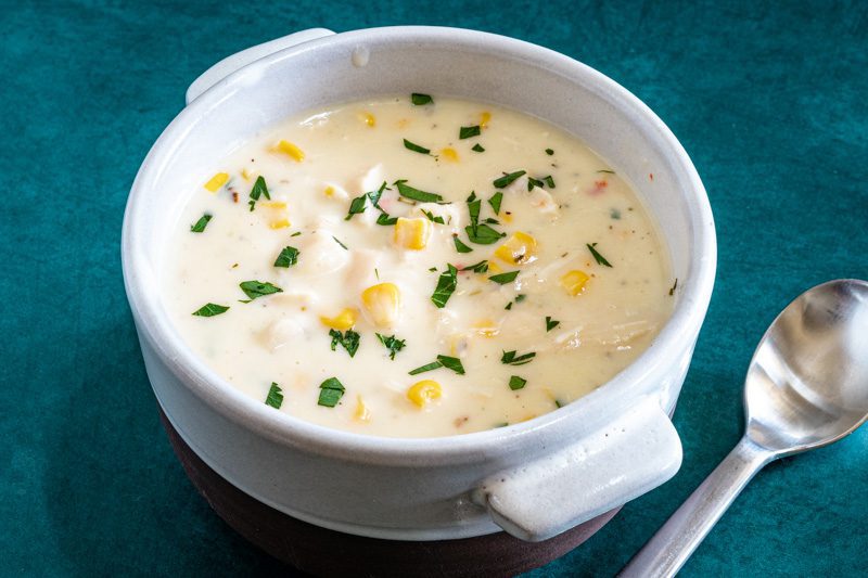 chicken chowder in a bowl with spoon