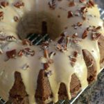 glazed apple bundt cake on a cooling rack