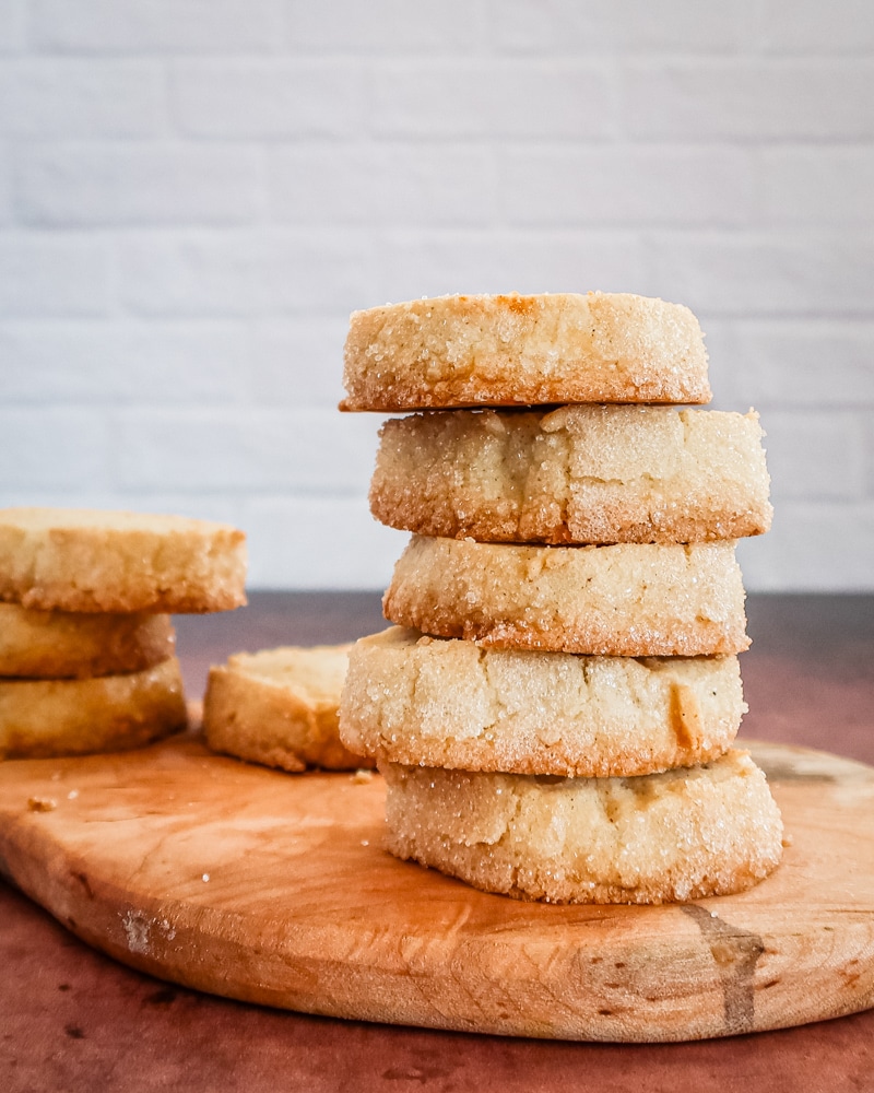 A stack of citrus cardamom sable shortbread cookies.