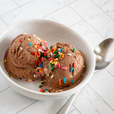 scoops of keto ice cream in a small bowl with sprinkles