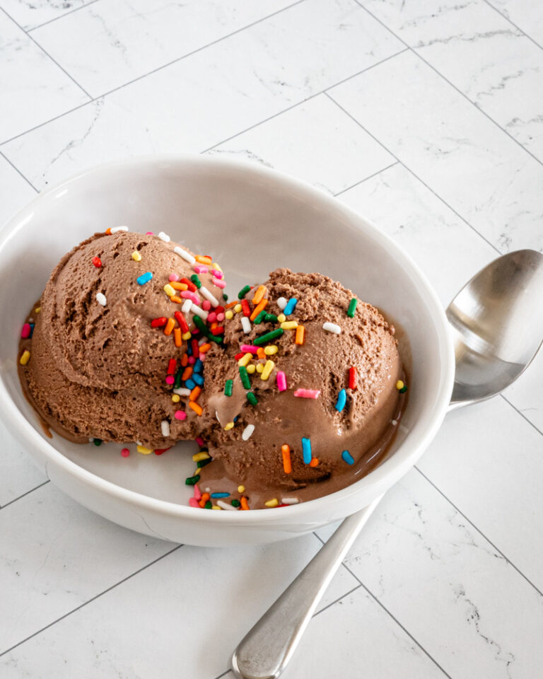 scoops of keto ice cream in a small bowl with sprinkles