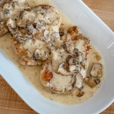 ranch pork chops with sauce on a platter