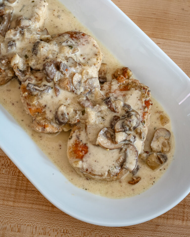 ranch pork chops with sauce on a platter