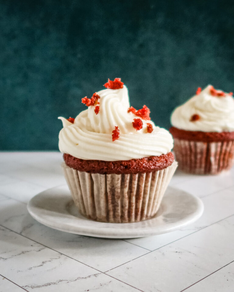A red velvet cupcake with another one in the background