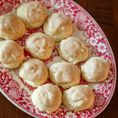Iced ricotta cookies on a decorative platter
