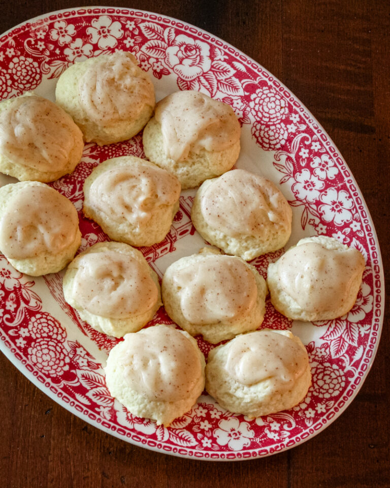 Iced ricotta cookies on a decorative platter