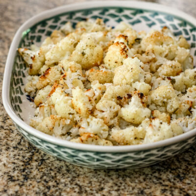 Roasted cauliflower with lemon in a serving dish