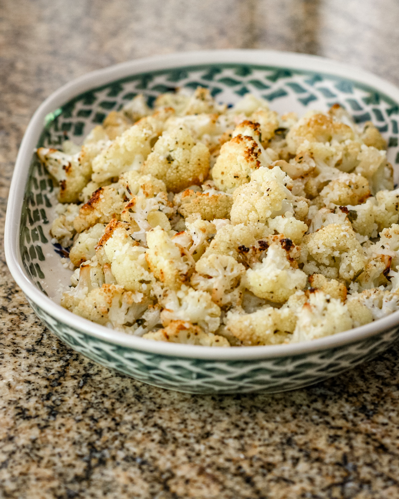 Roasted cauliflower with lemon in a serving dish