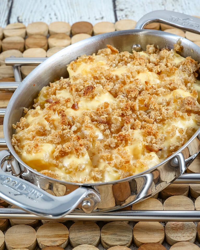 A baking dish with rutabaga gratin with breadcrumb topping and cheese.